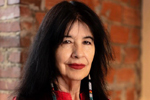 Joy Harjo against brick background